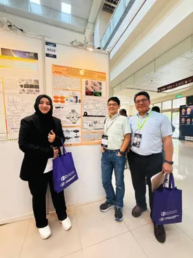 Three participants standing beside poster B020 at SDSE 2026.